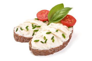Sandwiches with soft cream cheese Feta, with cherry tomatoes and basil leaves. Isolated on white backgroun.