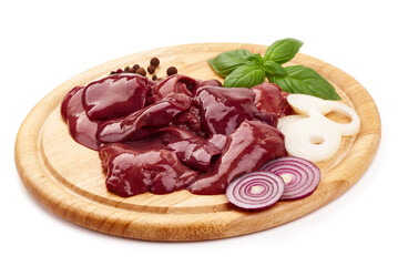 Chicken livers on the wooden board whith basil leves on a white background