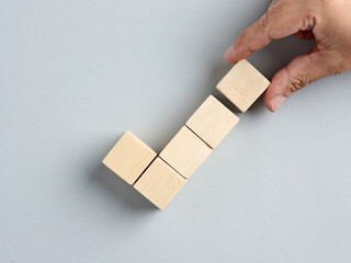 Approval, correct or right choice, voting yes or positive feedback concepts. Hand arranges wood...