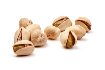 Heap of pistachios isolated on white background.