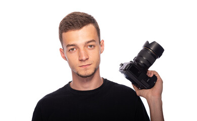 Young man with a DSLR camera on a white background.