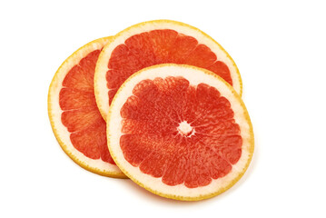 Organic grapefruit slices, isolated on white background.