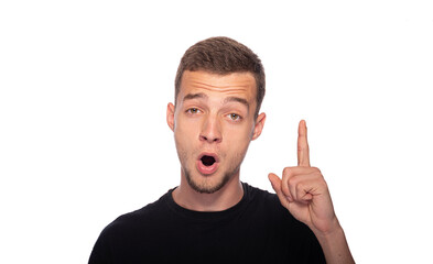 A young man opened his mouth and shows a thumbs up on a white background.