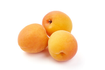 Isolated group of apricots. Two whole apricot, piece, half with leaves isolated on white background with clipping path