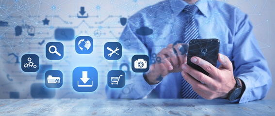  Human using smartphone. App icons with a download symbol. Development of applications. Social networks and Software