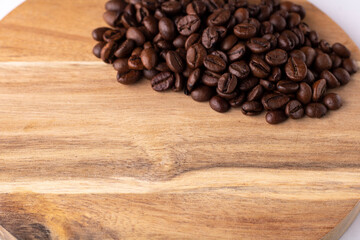 coffee piles of coffee beans on a wooden board