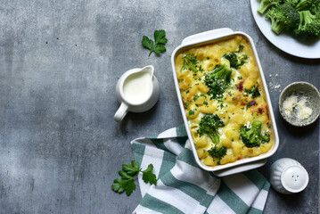 Mac and cheese with broccoli ( baked pasta with cream sauce ) . Top view with copy space.