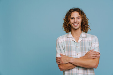 Ginger european man wearing shirt smiling and looking at camera