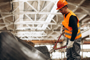 Man cutting steel at the factory