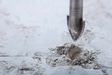 Ceramic drill bit make holes in concrete wall with industrial drill. Building work industry.