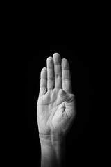 Fototapeta premium Hand demonstrating the Japanese sign language letter 'KE' or 'け' with copy space