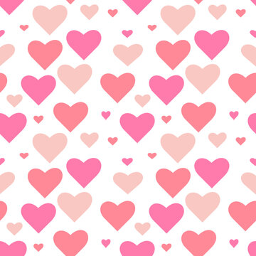 Pink hearts different sizes on white background. Seamless vector pattern.