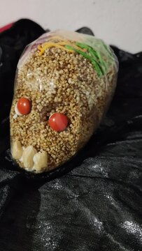 Rich sweet typical of Mexico, representation of the day of the dead, which is celebrated on November 2, sweet amaranth skull. Vertical video.