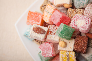A variety of colored Arabic and Turkish sweets on a plate