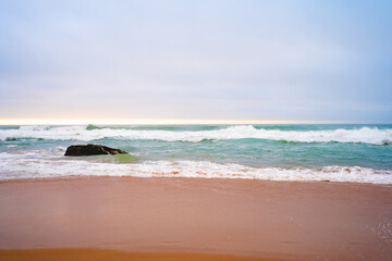 sandy beach and ocean with turquoise water