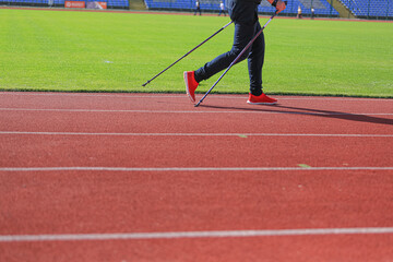 Athletes run and walk on the tracks in the stadium. the concept of sport and health.