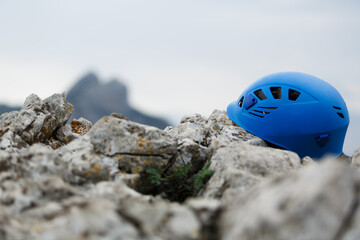 Rock climber's helmet on the mountain, the concept of climbing and sports.