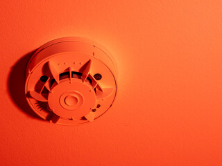 Smoke detector or fire alarm system on the ceiling.