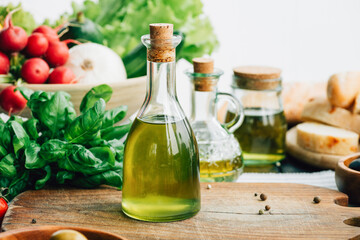 Fototapeta na wymiar olive oil bottles with vegetables
