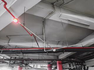 Installation of cables and plumbing in the parking lot of a mall.