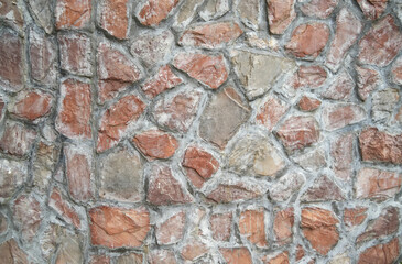 Stone wall texture background of grey brick stones.