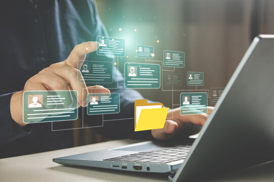 HR concepts and personal file storage, personal information management, checklists. Businessmen working in HR checklists of employees or job applicants through a virtual screen from tablet computer.