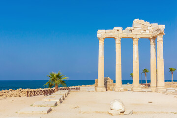 The ruined temple of Apollo, the God of sunlight. in Side (Turkey) with a stone-cut relief on the frieze. Famouse tourist destination. History, art or architecture concept