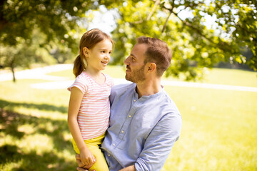 Fototapeta premium Father with daughter having fun at the park