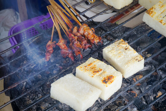 Sate maranggi or satay maranggi and Jadah bakar, uli bakar or grilled sticky rice, a traditional javanese cake made from glutinous rice with grated coconut grilled on the satay grill. 
