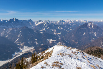 Snow shoe tracks leading to mountain near Zell Pfarre, Austrian Alps, Carinthia (Kaernten), Austria, Europe. Winter wonderland in Karawanks, Julian Alps. View from Freiberg on Hochstuhl, Stol, Triglav