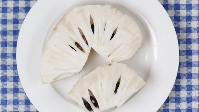  soursop fruit on a plate on table 