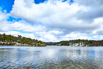 lake on winter with trees covered of snow in arareco lake, creel chihuahua 