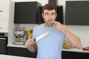 Man having a small accident in the kitchen 