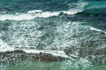 Background shot of aqua sea water surface.