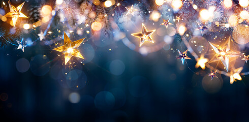 Christmas Lights - Stars String Hanging At Fir Branches In Abstract Defocused Background - obrazy, fototapety, plakaty