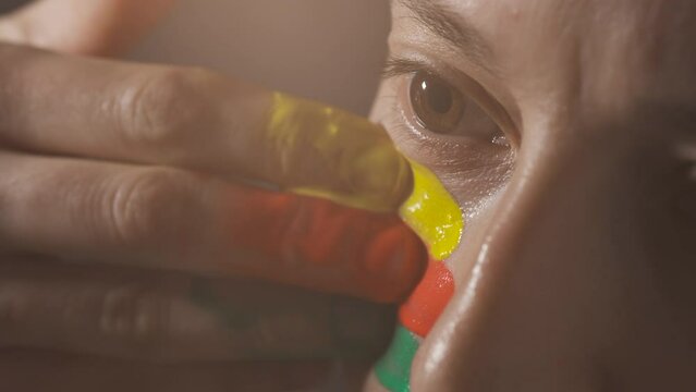 Supporter Painting Face. Football Fan Preparing for the Match. Colored Face with Flag Colors Green, Red and Yellow. Slow Motion 4K Prores 422