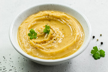 Vegetarian split pea soup puree with herbs and olive oil. Top view, copy space, flat lay.