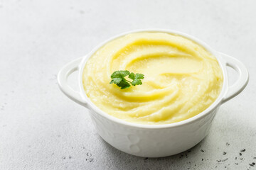 Creamy butter potato mash in a bowl. Top view, copy space, flat lay.