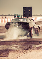 Dragster sets off on the racetrack. Dragster on the speedway. Drag wheel, torque, power, engine...