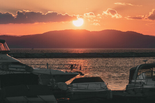 Sunset over Lake Champlain taken from Burlington, Vermont with Boats in the foreground
