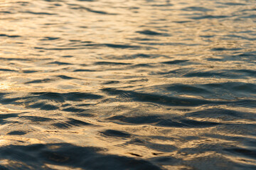 golden sunset reflected on water surface
