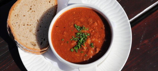 goulash soup with a slice of bread