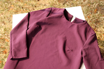 Classic purple shirt on a white background.