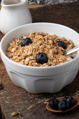 Natural curd with granola, blueberry and honey. Healthy food concept.