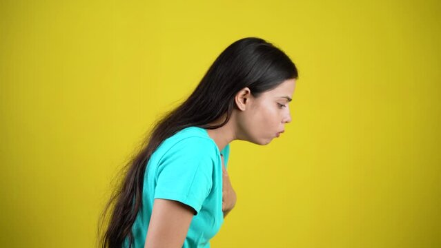Young woman over isolated background is suffering with cough and feeling sick