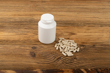 Fototapeta na wymiar Herbal Medicine Pill Bottle, Traditional Medicine Capsules, Supplement, Herb Capsule, Vitamins, Bio Supplement