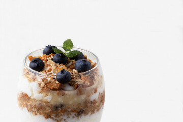 Natural curd with granola and blueberry. Healthy food concept. Copy space.