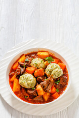 Beef Stew with Dumplings in bowl, top view