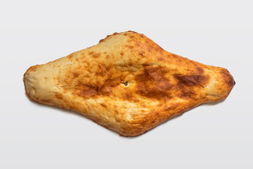 Georgian shoti bread with a characteristic shape on a light background