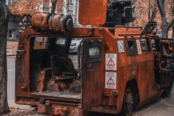 Fototapeta na wymiar burnt armored car in the center of Kyiv 22.10.2022